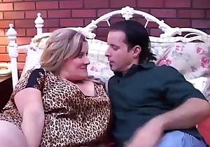 Blonde riding his cock on a rather large bed