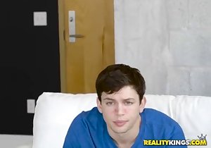 Tanned blonde fucked on all fours on a bed